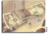 Why is Money Stuck to the Wall of the International Space Station?