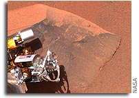 Healthy Spirit Cleans a Mars Rock; Opportunity Rolls