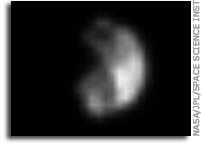 NASA Scientist Hopes to Explain Saturn’s Mysterious Black Moon