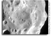 NASA Cassini’s Flyby of Phoebe Shows a Moon with a Battered Past