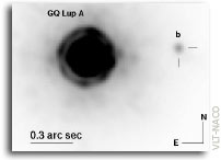 Evidence for a co-moving sub-stellar companion of GQ Lup
