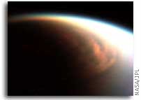 NASA Cassini finds cloud engulfing Titan’s North Pole