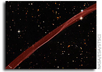 Hubble Sees Stars and a Stripe in Celestial Fireworks